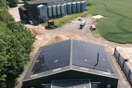Farm grain store with solar panel on the roof